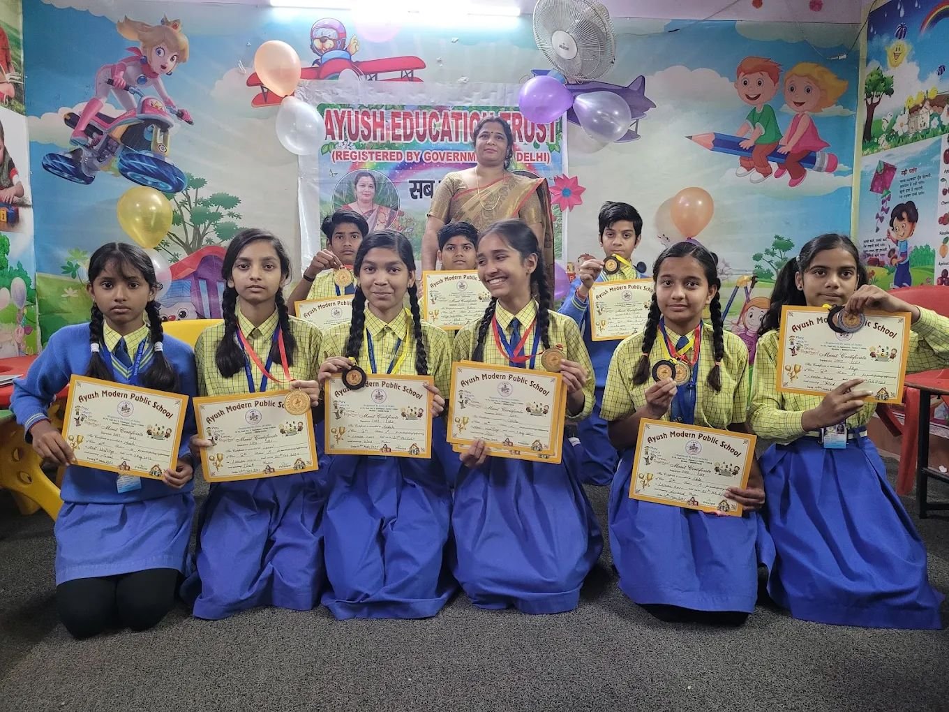 Merit certificates and medals at Ayush Public School